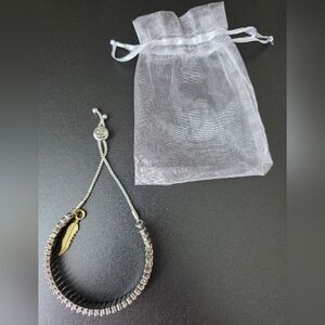 Jessica Simpson Silver Bracelet with Gold Feather Charm